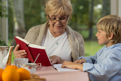 Cute boy spending time at grandma's home