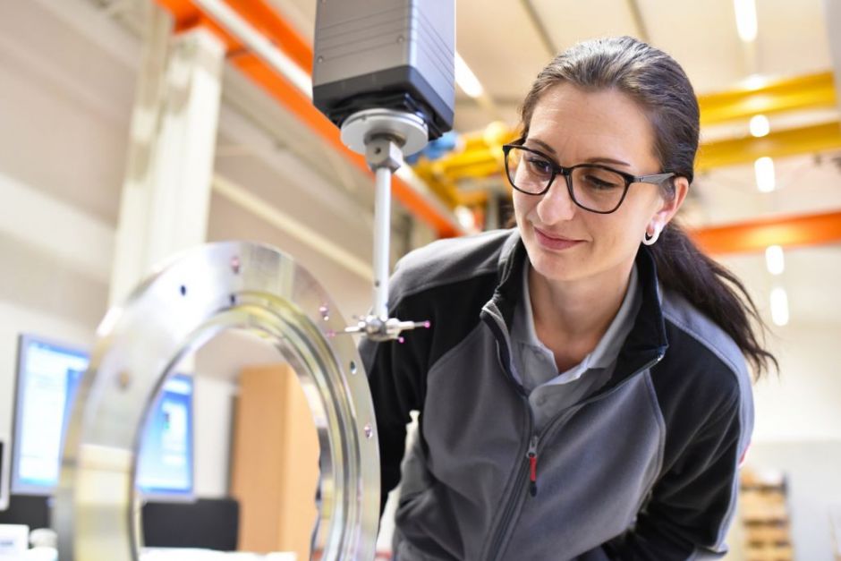 industrieblick – stock.adobe.com woman working in the quality control in the industry - measurement of a workpiece