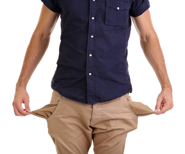 © Africa Studio – Fotolia.com Man showing his empty pockets, isolated on white